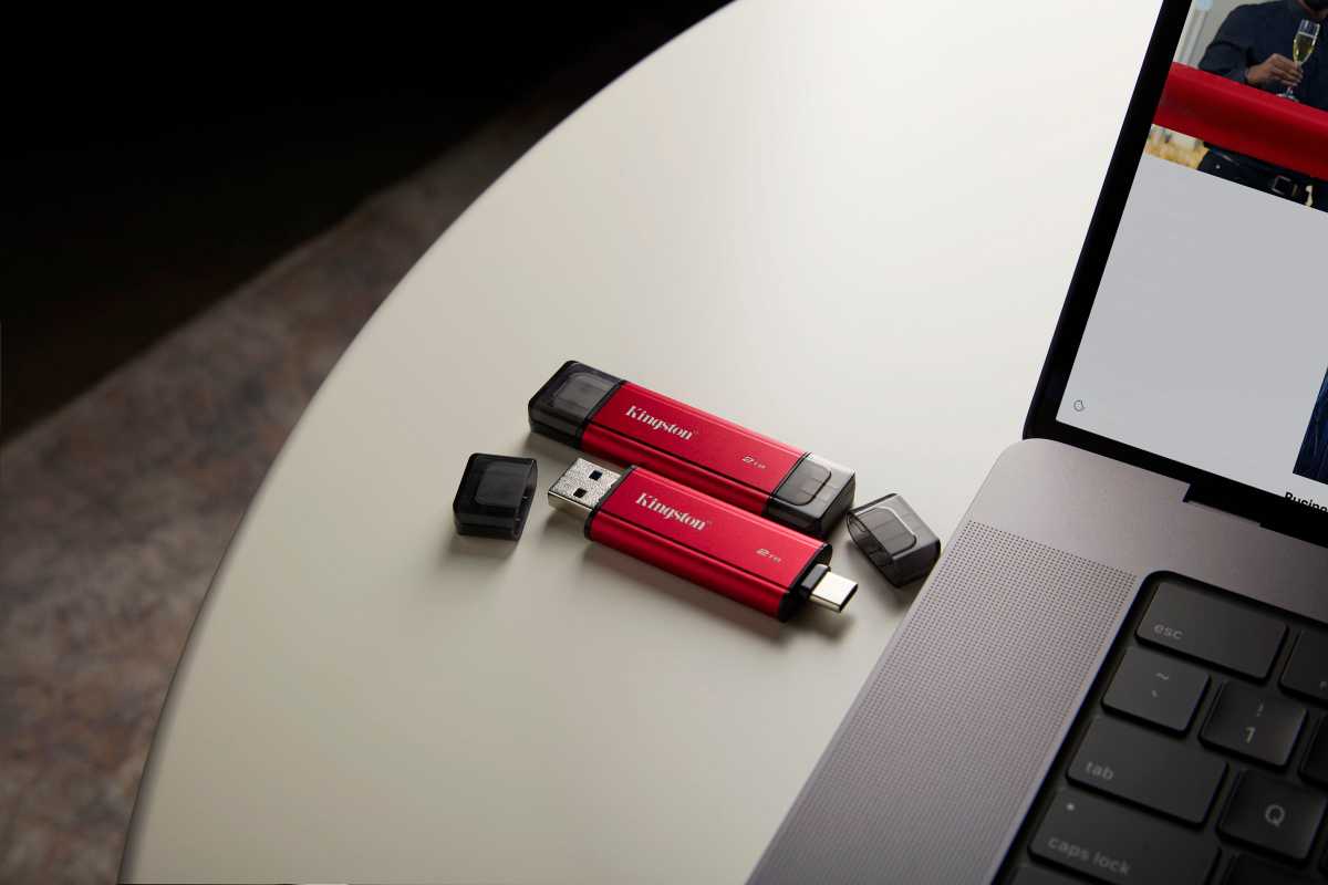 Dual Portable SSD drive sitting beside laptop